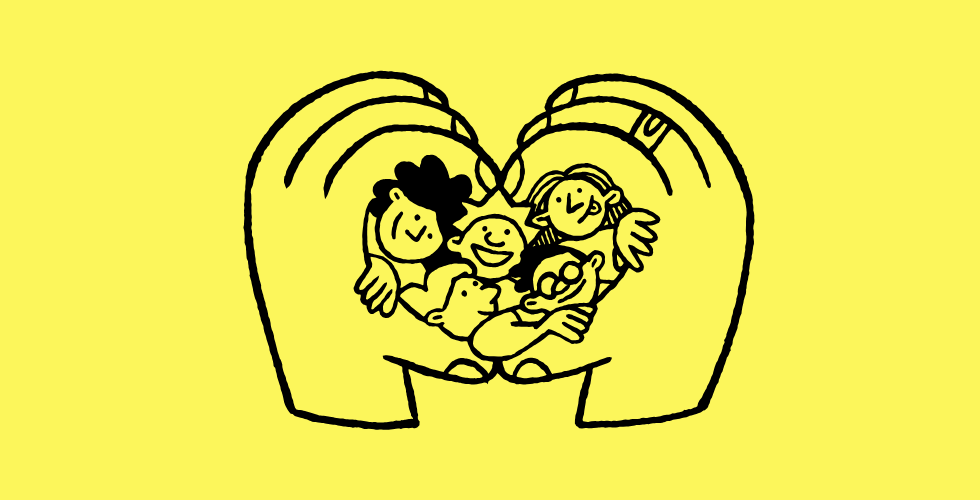 hands in a heart shape holding people