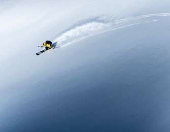 A man snowboarding in Goldwin gear