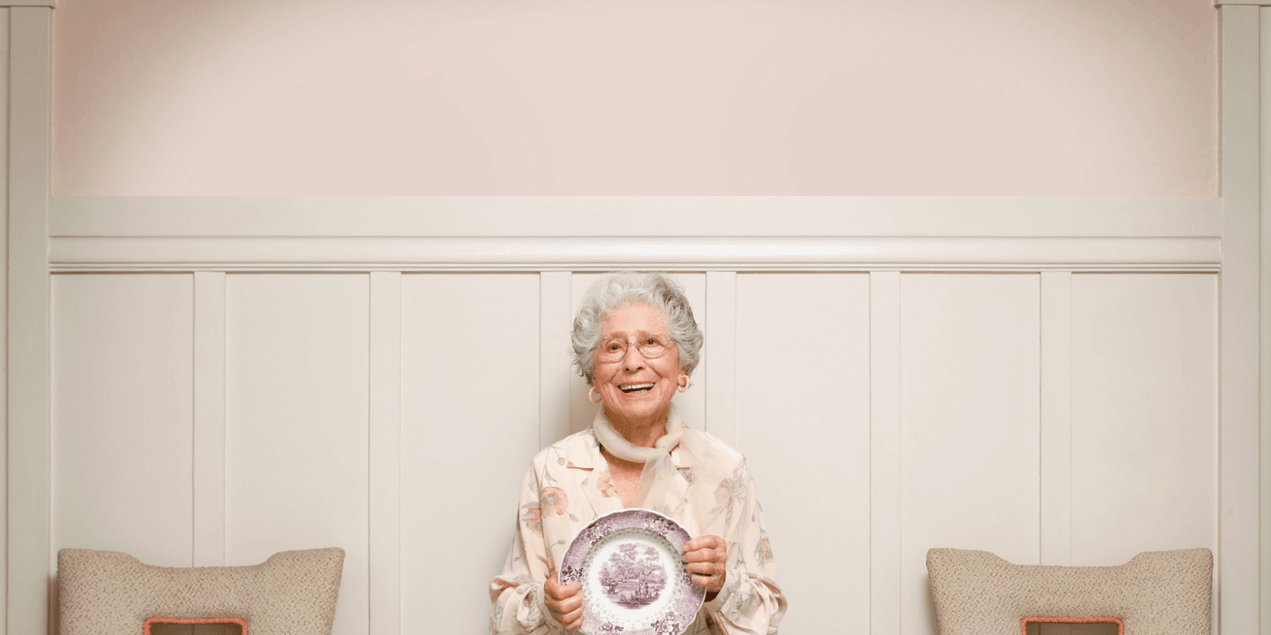 Grandma standing with a plate