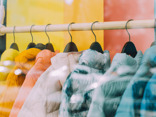 rack of colorful winter coats 