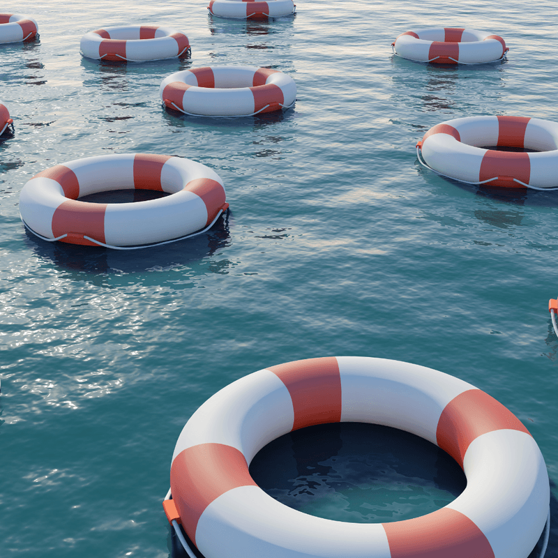 life rafts floating on water 