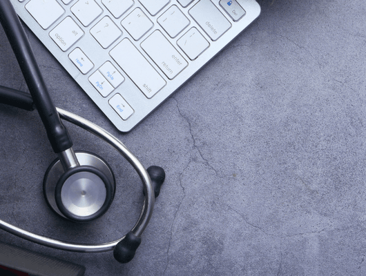 medical stethoscope and keyboard on black background 