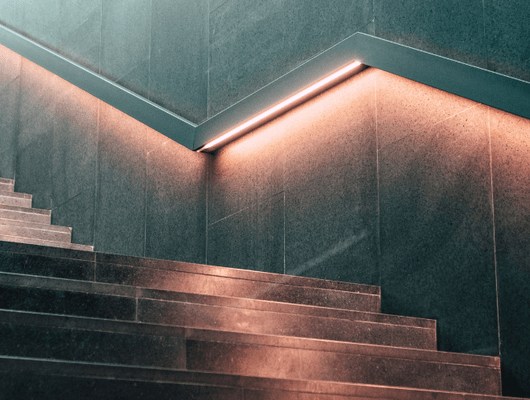 lit staircase with railing 