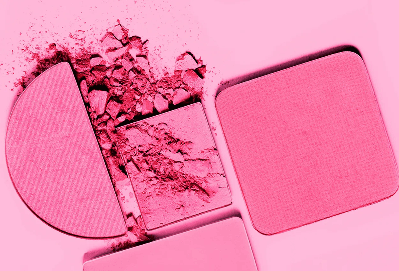 Pink powder makeup on a pink background